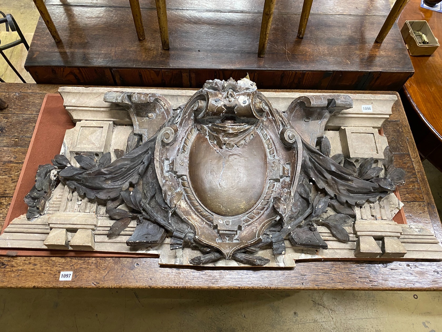 A 19th century French wood and composition pediment, width 123cm, height 50cm